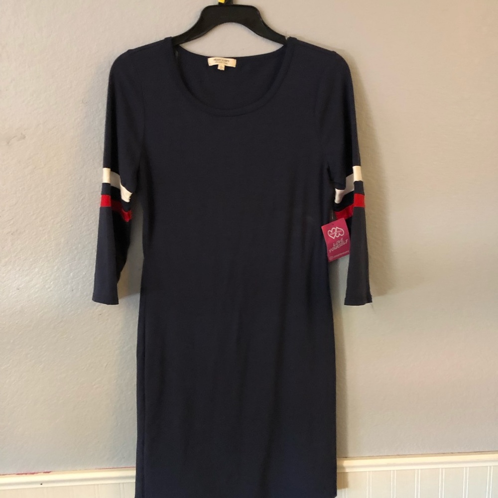 Blue dress with red and white stripes on sleeves